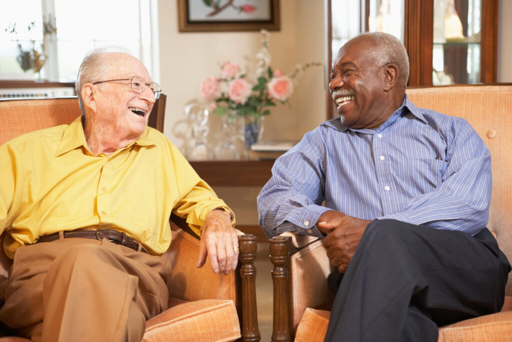 Senior men relaxing in armchairs